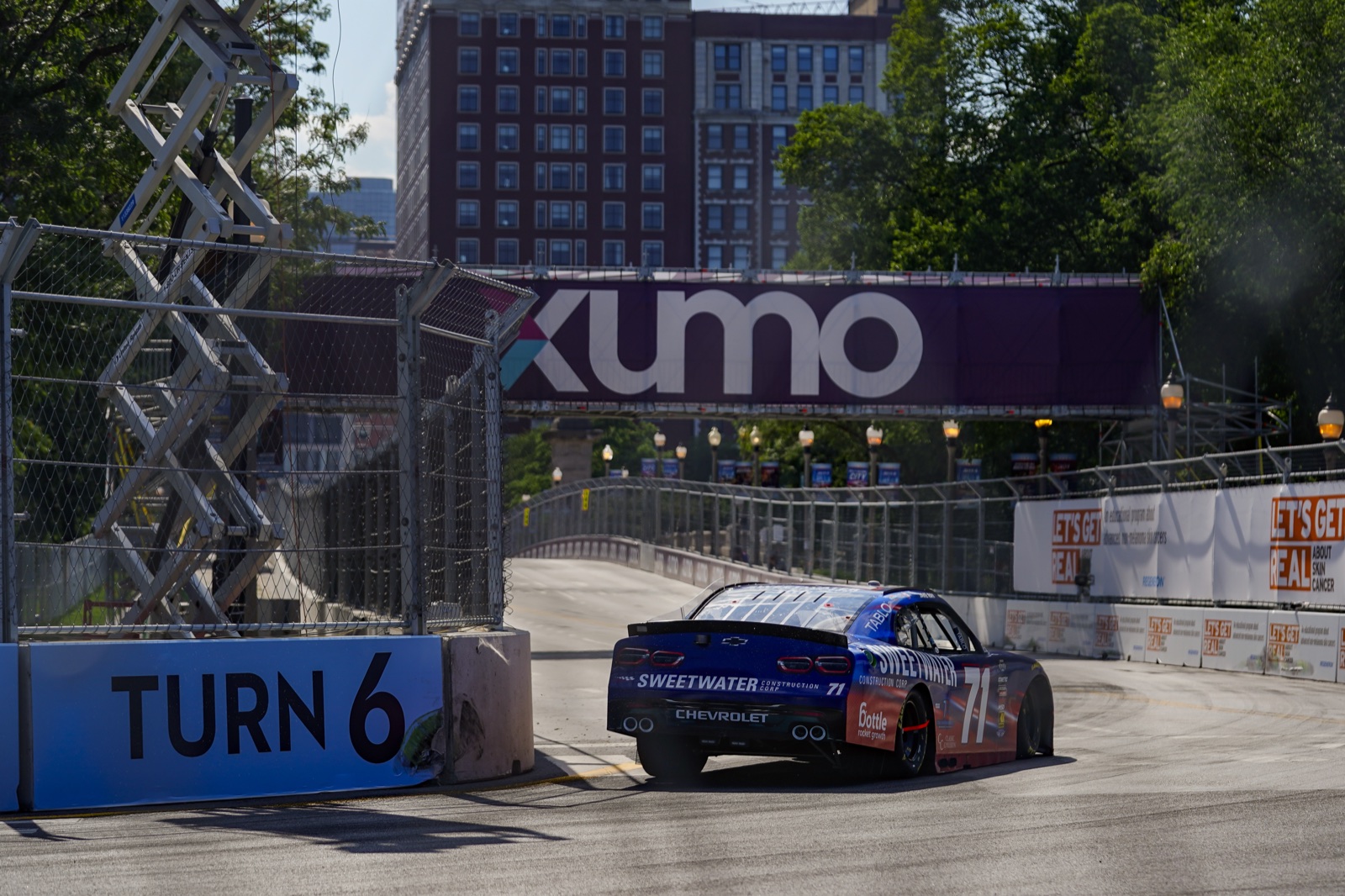 The number 71 race car with BRG branding taking Turn 6 at the Chicago street race